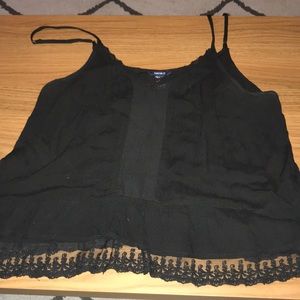 Black tank top with sheet cutouts